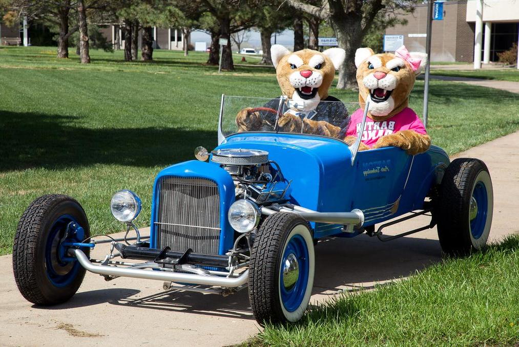 Bart and Miss Kitty in the Barton hot rod